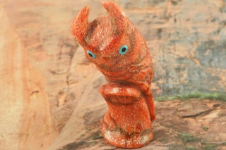Zuni Owl Fetish created by Zuni Artist Hudson Sandy. Signed by the artist. Hand carved from Genuine Apple Coral and Black Jet with Turquoise eyes.